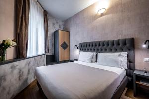 Postel nebo postele na pokoji v ubytování Florence Old Bridge B&B