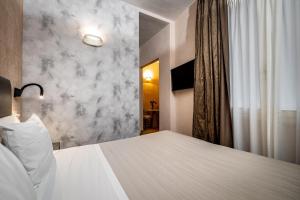 Postel nebo postele na pokoji v ubytování Florence Old Bridge B&B