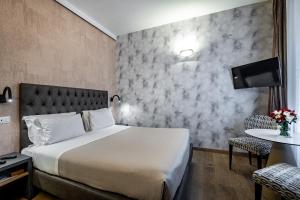 Postel nebo postele na pokoji v ubytování Florence Old Bridge B&B
