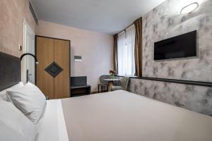 Postel nebo postele na pokoji v ubytování Florence Old Bridge B&B