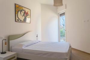 Ένα ή περισσότερα κρεβάτια σε δωμάτιο στο Casa Del Sole a 50 mt dal mare - Aria condizionata