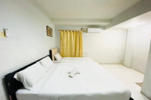 Ένα ή περισσότερα κρεβάτια σε δωμάτιο στο Hotel O Jodoh Near Grand Batam Mall Formerly Agung Hotel