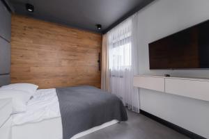 Łóżko lub łóżka w pokoju w obiekcie ApartView Plażowa Residence Szczyrk by Rent like home