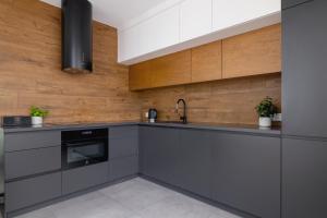 Kuchnia lub aneks kuchenny w obiekcie ApartView Plażowa Residence Szczyrk by Rent like home