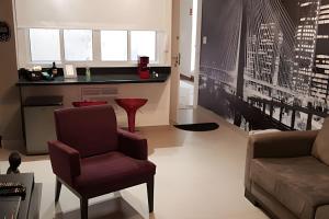 a living room with a couch and a chair at 2 DTS - Bela Vista - espaçoso + aconchegante in Sao Paulo +28 photos