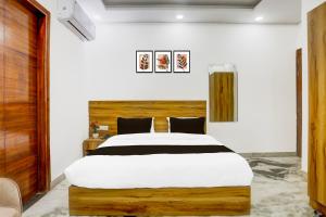 Postel nebo postele na pokoji v ubytování Super Hotel O The Param continental