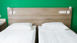 Postel nebo postele na pokoji v ubytování Raziotel Kyiv Yamska