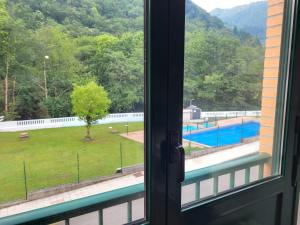 a view of a pool from a window at Belmonte in Belmonte de Miranda