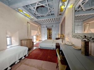 Postel nebo postele na pokoji v ubytování Riad Slitine & Spa + 37 fotografií