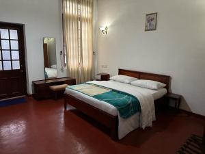 Postel nebo postele na pokoji v ubytování Princess Bungalows