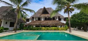 Bazén v ubytování Milele Beach Resort nebo v jeho okolí