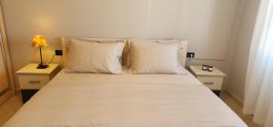 Ένα ή περισσότερα κρεβάτια σε δωμάτιο στο Grid Apartment