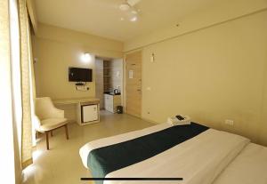 TV a/nebo společenská místnost v ubytování Paradise Elegance Inn