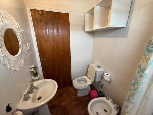a small bathroom with a sink and a toilet at Nani 1 in Concordia
