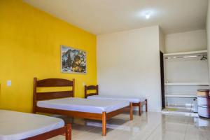 En eller flere senge i et værelse på Rancho Boa Vista - Capitólio - MG