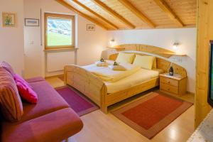 Postel nebo postele na pokoji v ubytování Residence Weisskugel Langtaufers Südtirol