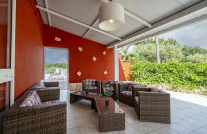 a living room with couches and a table at Casale dello Zio, private pool by IL PUMO DI PUGLIA in Castellana Grotte