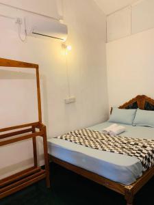 Postel nebo postele na pokoji v ubytování Hotel Surfing