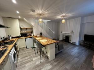 a kitchen with a table and a stove top oven at Entire home in Eccleshall in Eccleshall