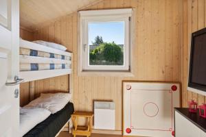 Ένα ή περισσότερα κρεβάτια σε δωμάτιο στο Excellent Cottage With Sauna And Spa, 10 Persons
