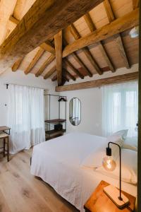 Postel nebo postele na pokoji v ubytování Locanda sul fiume