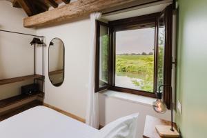 Postel nebo postele na pokoji v ubytování Locanda sul fiume