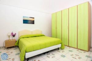 A bed or beds in a room at Villa Antica Macina