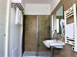 Koupelna v ubytování Vasto Aparthotel + 18 fotografií