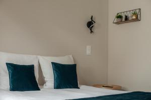 Ένα ή περισσότερα κρεβάτια σε δωμάτιο στο Appartements avec garage privé - Latre Location