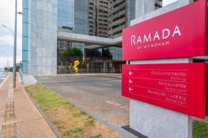 a sign for rambada in front of a building at Flat Particular no Hotel Ramada Alvorada Brasília in Brasilia