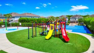 a playground with a slide in a park at Encore Resort and Water Park at Reunion by Rentyl in Kissimmee