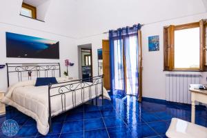 A bed or beds in a room at Villa Antica Macina