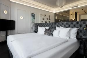 Postel nebo postele na pokoji v ubytování O11 Boutique Hotel Vienna