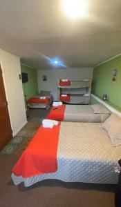 Postel nebo postele na pokoji v ubytování Hostal Casa Alegre