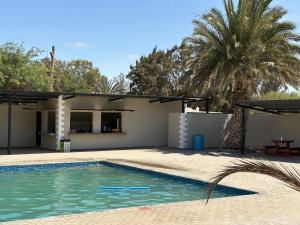 a villa with a swimming pool and a house at Goanikontes-Oasis in Goanikontes