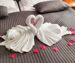 Postel nebo postele na pokoji v ubytování Hotel Limba CTT