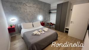Posteľ alebo postele v izbe v ubytovaní san rocco apartments