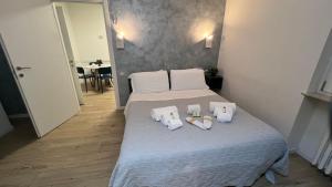 Posteľ alebo postele v izbe v ubytovaní san rocco apartments