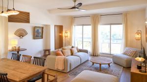 a living room with a couch and a table at Mila in Saint-Denis