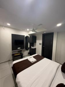 Ένα ή περισσότερα κρεβάτια σε δωμάτιο στο Hotel Sunview