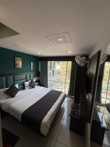 Ένα ή περισσότερα κρεβάτια σε δωμάτιο στο Hotel Sunview