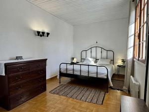 a bedroom with a bed and a dresser in it at Maison rénovée à Saint-Georges-d'Oléron, 6 pers, proche pistes cyclables - FR-1-246A-344 in Saint-Georges-dʼOléron