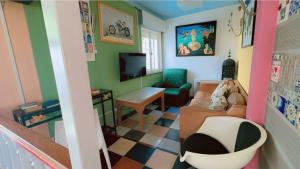 a living room with a couch and a chair at Lagos Central Hostel in Lagos