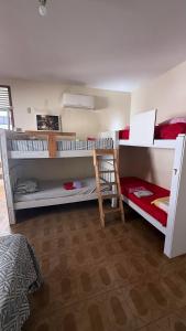 a room with two bunk beds and a bed at Casa do Uai in João Pessoa