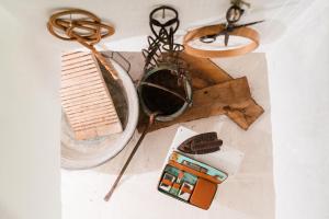 a table with a cell phone and other items on it at Letto & Merenda in Nardò +33 photos