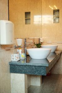 a bathroom with two sinks on a counter at Yesterday Homestay Hue in Thôn An Hòa +44 photos
