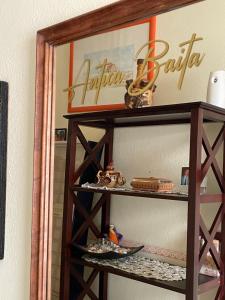 a shelf in a room with some items on it at ANTICA BAITA in Gergei