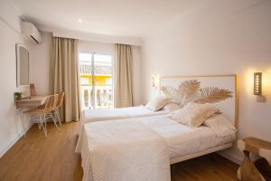 Postel nebo postele na pokoji v ubytování Hotel Cupidor