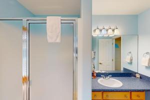a bathroom with a sink and a mirror at Hip Nautic in Rockaway Beach +28 photos