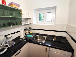 Kuchyň nebo kuchyňský kout v ubytování Apartment Carmen